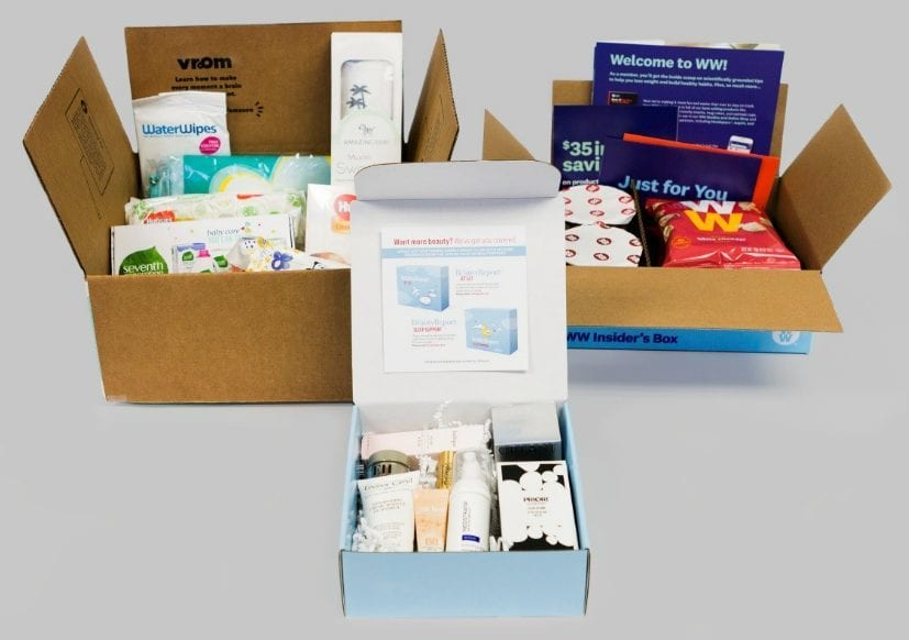 Three opened subscription and sample kits with printed inserts
